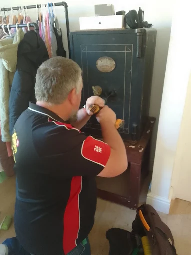 AAA Locksmiths technician opening a safe on a callout