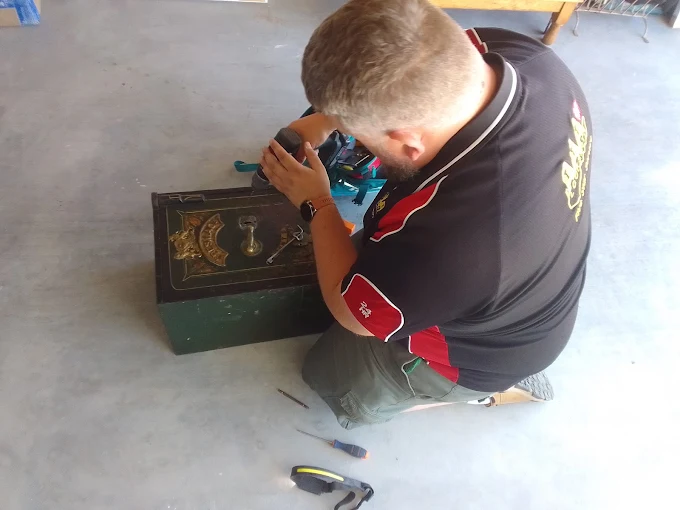 AAA Locksmiths technician opening an old safe left behind with no key