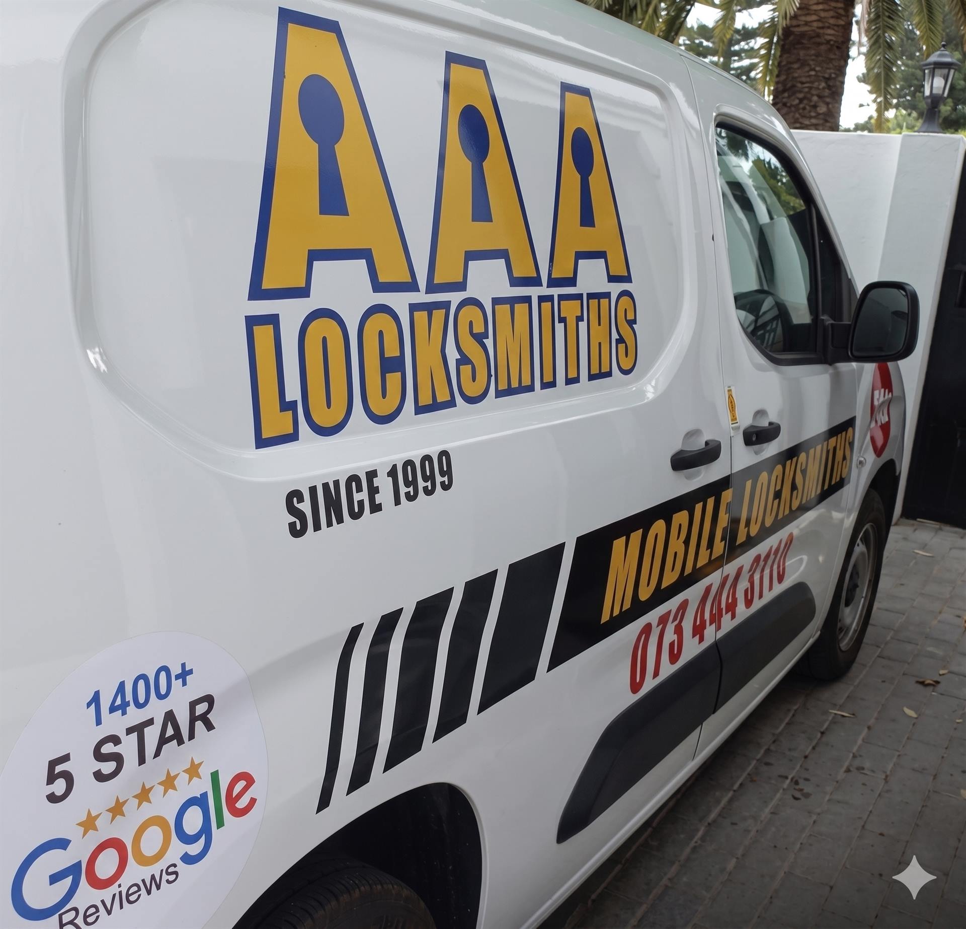 A branded AAA Locksmiths van, signwritten with the company name, Cape Town phone numbers and 'since 1999'.