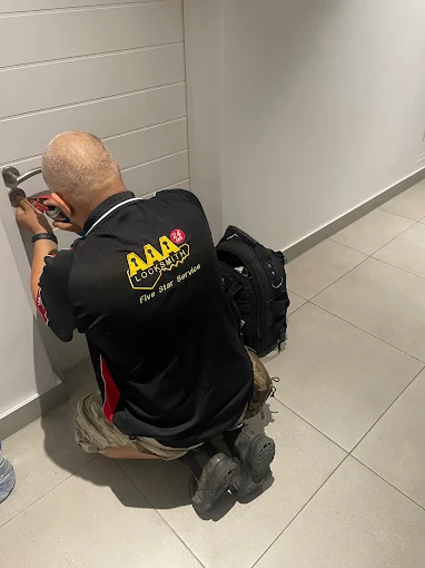 AAA Locksmiths technician installing a deadbolt